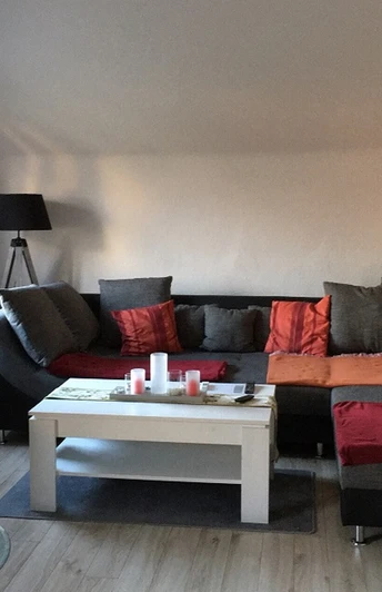 Ferienwohnung Fischer - Wohnzimmer mit Kamin