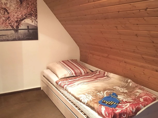 Slaapkamer van het appartement Reimers