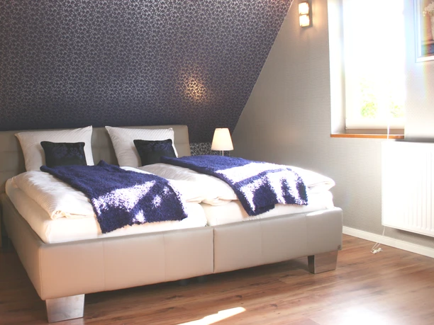 Das Schlafzimmer im Fachwerkhaus am Teich Das Schlafzimmer im Fachwerkhaus am Teich