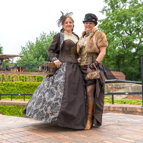 Two elaborately costumed women in steampunk look stand on the Moritzbastei, events, scene, music