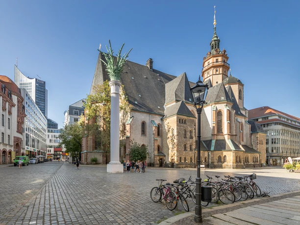 View of the Nikolai Church and the Nikolai Column on the Nikolai Churchyard where the peace prayers that led to the Peaceful Revolution took place, cultural institution, history of Leipzig, sights