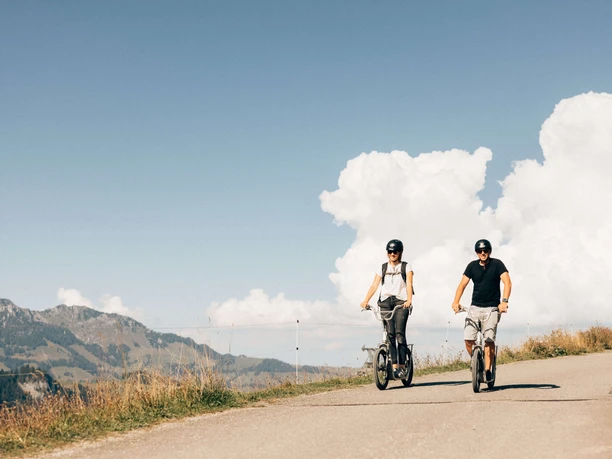 Scooter riding at the Wiriehorn Two scooter riders on the mountain road