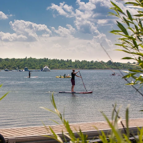 One person paddling on a SUP on Lake Schladitz