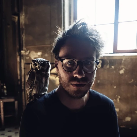 An owl sits on the shoulder of Clemens Christian Poetzsch