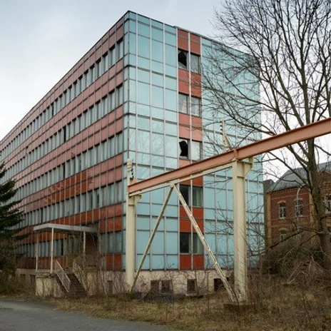An old typical former VEB Feuerungsbau in blue red, history, architecture in Leipzig