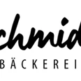 Bäckerei Schmidt Logo der Bäckerei Schmidt mit elegantem Schriftzug und dem Wort "Bäckerei" in Großbuchstaben.