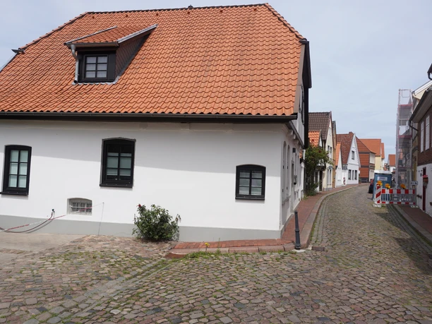 Historic fishing district in Verden with picturesque half-timbered houses and cobblestone streets.