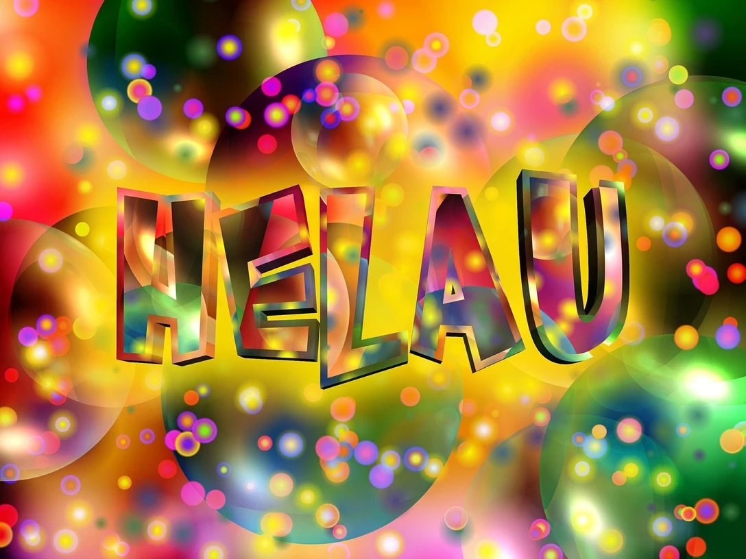 Karneval in Bad Driburg Bunte, leuchtende Schrift "Helau" mit farbenfrohen Kreisen und Punkten auf hellem Hintergrund.