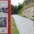 Infotafel über Wülfrath am PanoramaRadweg niederbergbahn Eine Infotafel am PanoramaRadweg Niederbergbahn mit Infos zur historischen Altstadt von Wülfrath.