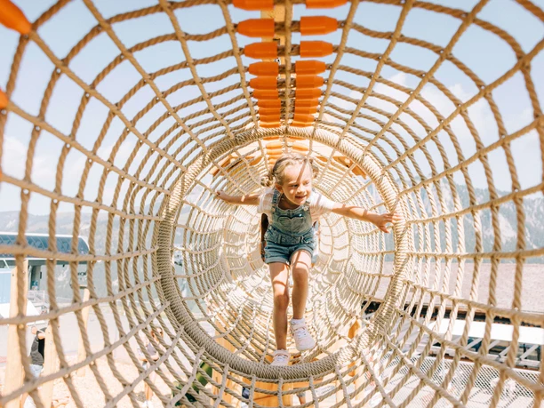 Climbing fun in the rope tunnel Girl in the rope tunnel