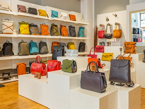 A view of the sales area of Taschenkaufhaus Leipzig with many colorful bags