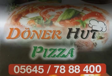 Döner_Hut_Pizza.JPG Werbung für ein Restaurant mit Spezialitäten wie Döner, Pizza und weiteren Speisen in bunter Aufmachung.