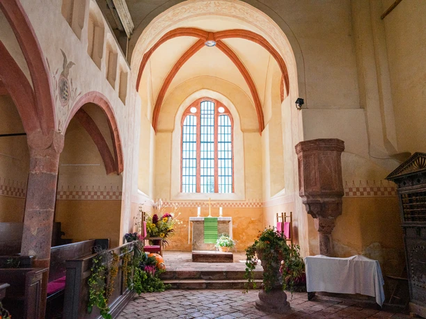 Light-flooded altar in Buch Monastery, stone, flowers, ornaments