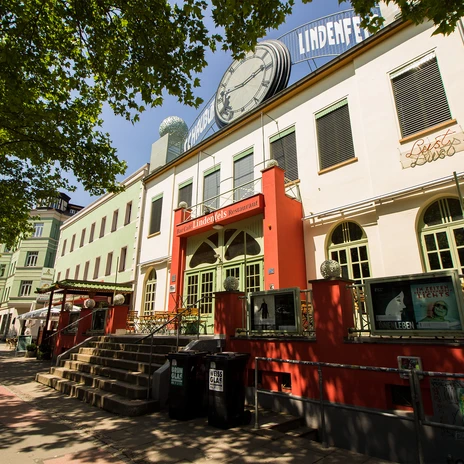 Entrance of the Schaubühne Lindenfels from the frog's perspective, houses, trees