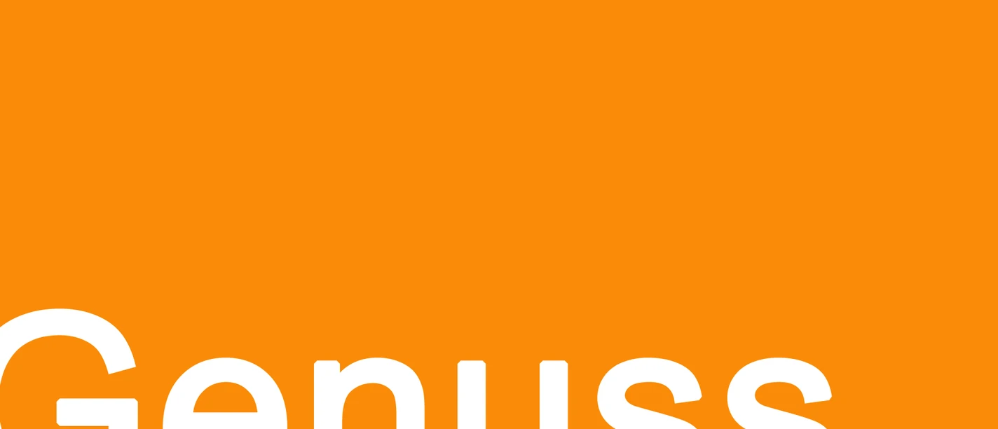 Genuss.jpg Orangefarbener Hintergrund mit dem Wort "Genuss" in großer, weißer Schrift unten links.