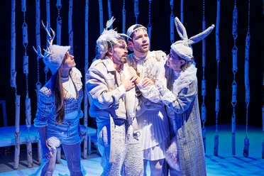 Comedia Four characters in bizarre, fairytale costumes on the stage of the Comedia Theater Cologne.