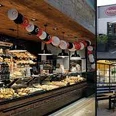 Bäckerei mit Auslage voll frischer Backwaren, freundlichen Mitarbeitern und einladendem Innenhof.