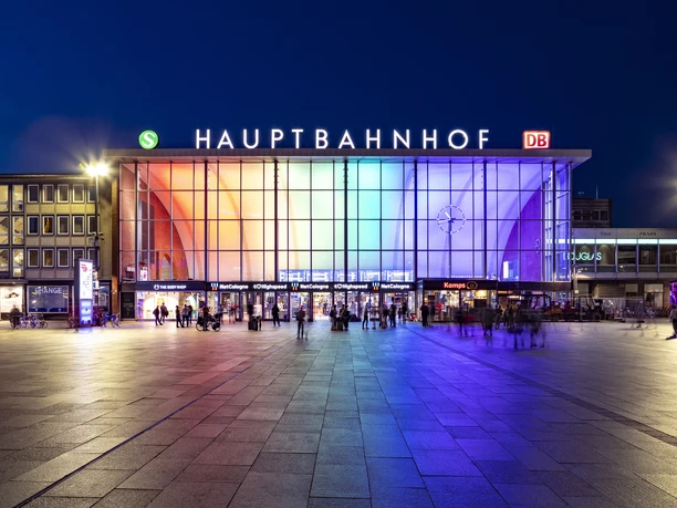 Köln Hauptbahnhof The entrance to Cologne Central Station at night, illuminated in rainbow colors.