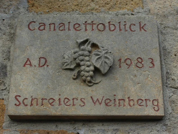 Note Canaletto view on the path Stone plaque with the inscription "Canaletto Blick A.D. 1983 Schreiers Weinberg" and a relief depiction of grapes and leaves.