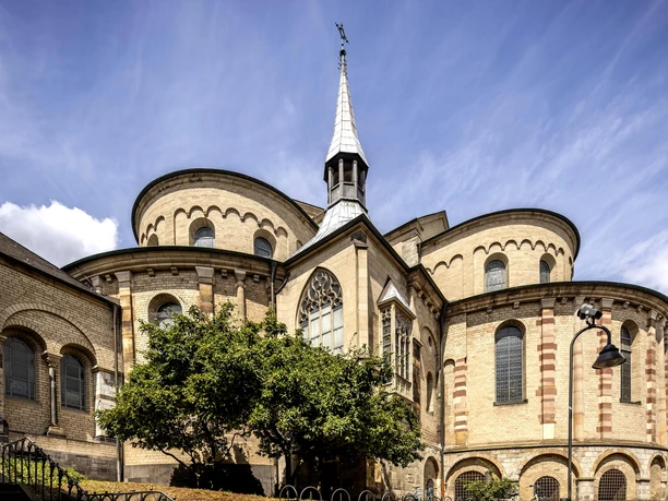 St. Mary in the Capitol Sankt Maria im Kapitol in Cologne: Romanesque basilica with striking arched windows and spire.