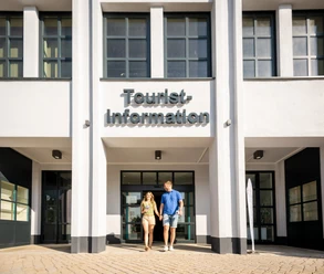 Couple leaves the tourist information office