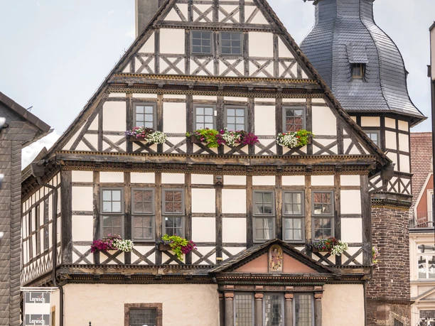 Facade of the historic town hall with richly decorated bay window