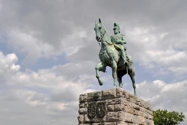 Equestrian statue of Emperor Frederick III. Equestrian statue of Emperor Frederick III in Cologne: a bronze equestrian monument on a stone pedestal under a dramatic sky.