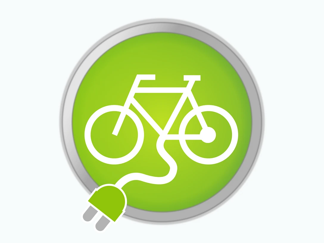 E-Bike-Ladestation Ein grünes Symbol mit Fahrrad und Stromstecker als Symbol für E-Bike-Ladestationen.