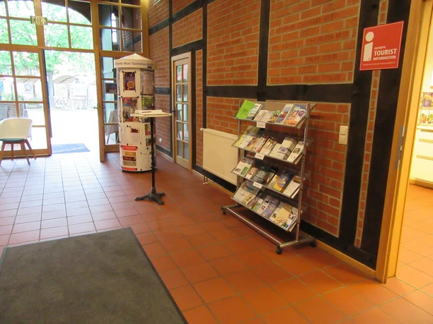 A brochure stand with tourist information is available in the hallway of the guest house.