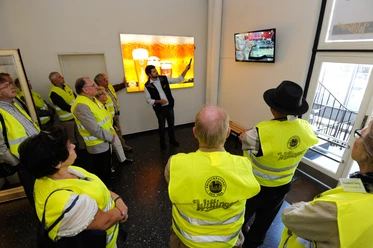 Group of visitors on a guided tour of the private brewery in Wittingen