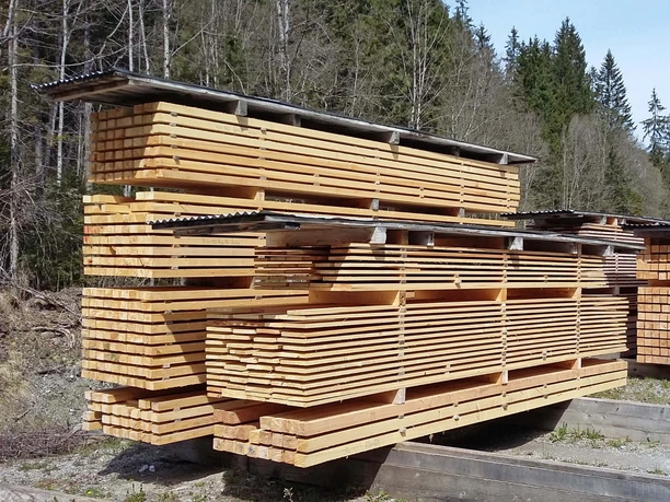M. Aebersold sawmill at the Diemtigtal Wooden planks are stacked in piles of beige
