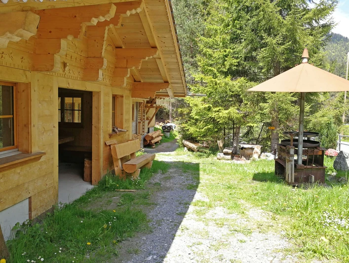 Fireplace with rustic barbecue hut