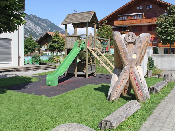Playground with climbing tower and slide