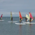 Windsurfschüler in Munkmarsch