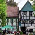Kleines Haus Het vakwerkgebouw met terras in Bad Essen waar café en bistro das Kleine Haus gevestigd is