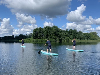 Stand up Paddling am Hüttenseepark Stand up Paddling am HüttenseeparkStand up Paddling at the Hüttensee Park