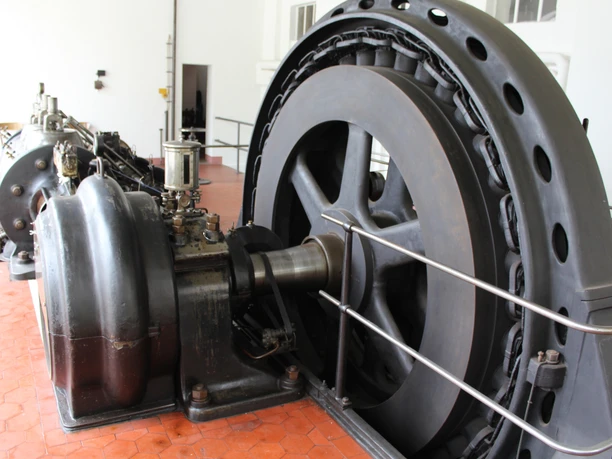 A historic steam engine with a large flywheel in the mustard factory in Eystrup, Lower Saxony.