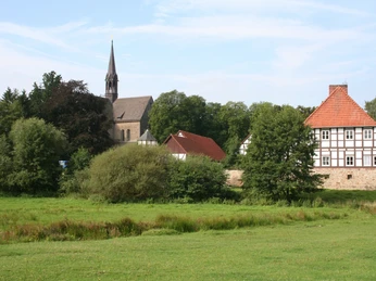 The Loccum Monastery with its church and historic buildings sits enthroned in an attractive green setting.