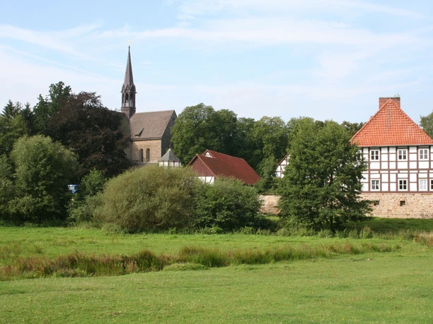 The Loccum Monastery with its church and historic buildings sits enthroned in an attractive green setting.
