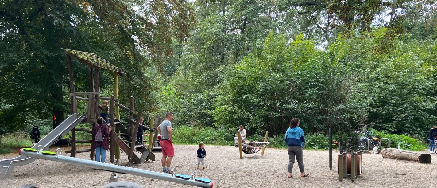 Shady playground for small children in the riparian forest on the border with Schleußig