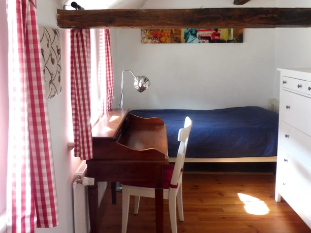 Eenpersoonskamer in het vakantiehuis Reethuus