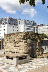 Roman sewer Old Roman sewer in Cologne, solid stone walls, modern buildings in the background.
