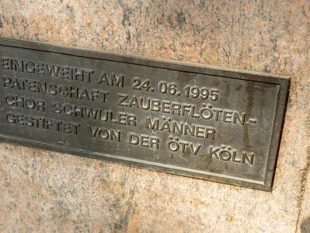 Rosa Winkel Memorial Bronze plaque with engraving: "Inaugurated on 24.06.1995, sponsorship of the Magic Flute Choir of gay men, donated by the ÖTV Cologne."