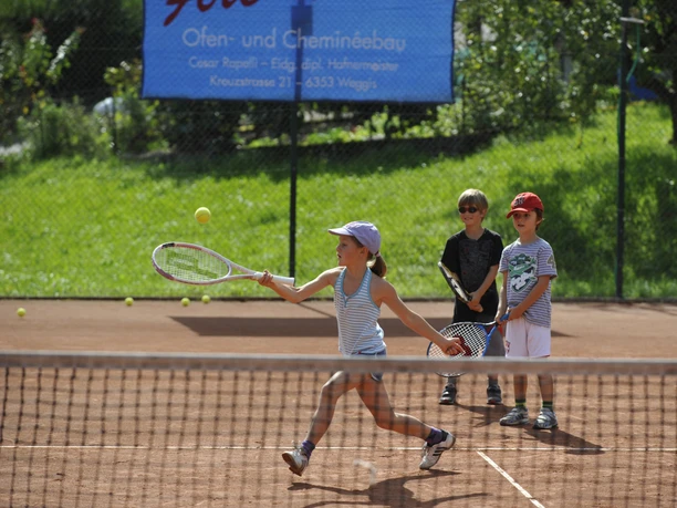 Tennis Child plays tennis