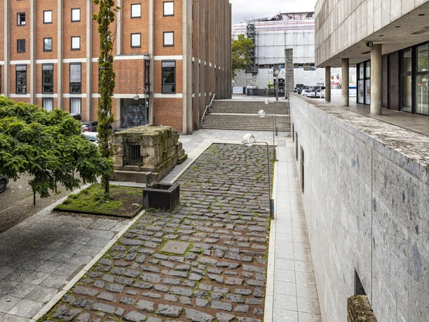 Roman harbor road Roman harbor road in Cologne, paved path between modern buildings