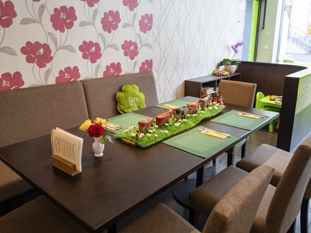 The bright café invites young and old to linger - there is a small play corner for children