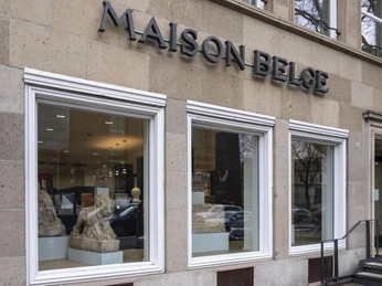 Belgian House RGM The façade of the Belgian House in Cologne, with large windows and clear lines, shows elegance.