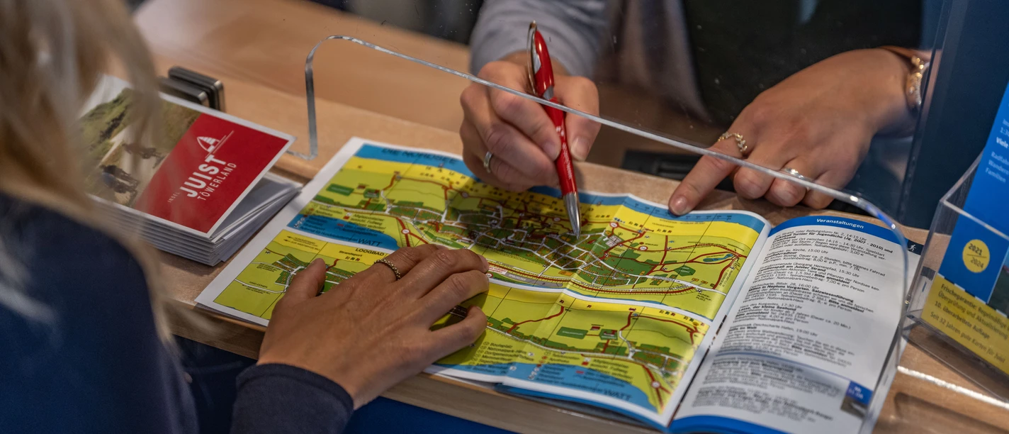 Leistung des Gästebeitrags auf Juist: Strandlooper und Infoheft