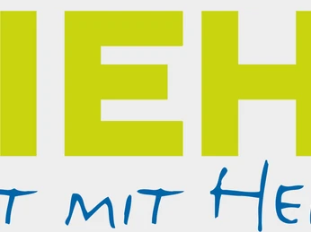 Logo der Stadt Nieheim mit gelber Schrift und einem roten Wappen mit einem gelben Kreuz. Darunter der Slogan.