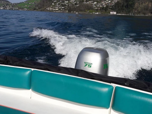 Sail and More sailing school and boat trips Travelling by motorboat on Lake Lucerne